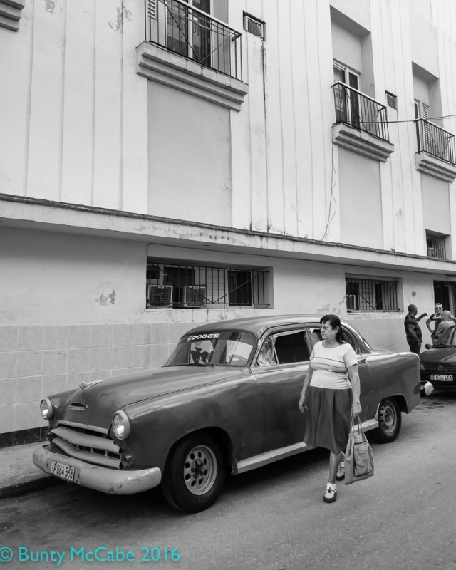 Street portrait with car. My last hours of shooting in Central Havana.